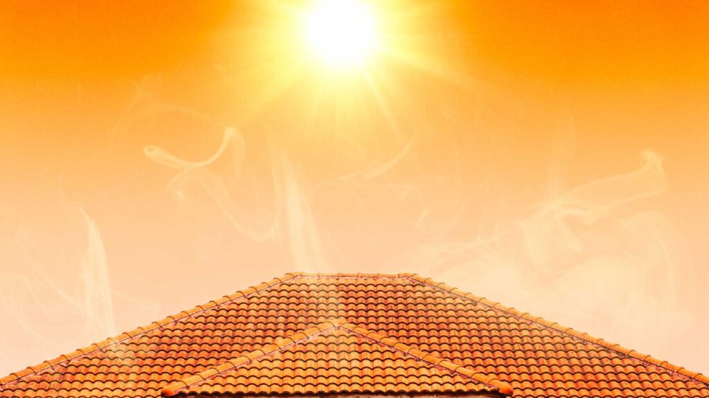 Sunlight and heat radiate over a tiled roof.