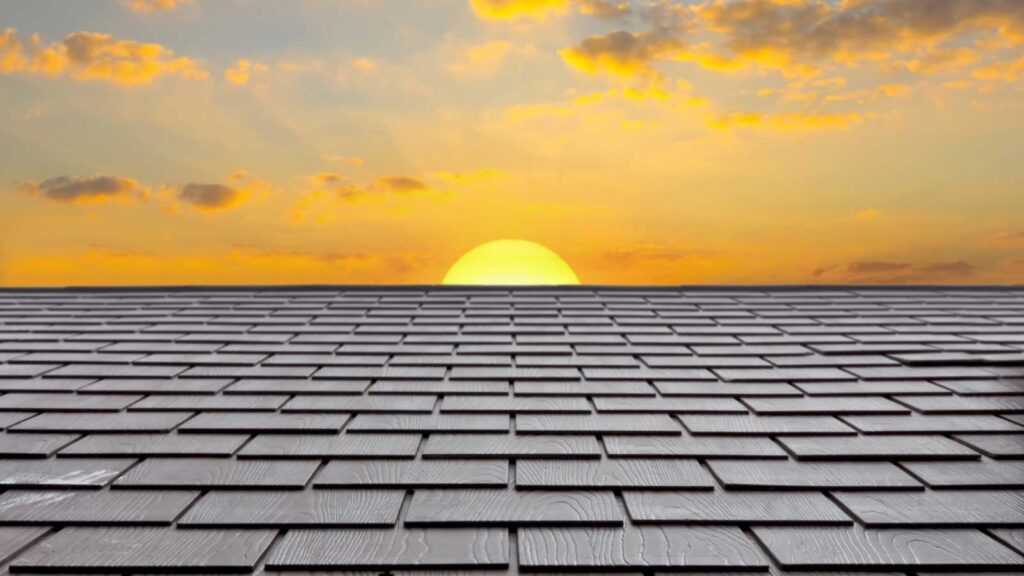 Sunset over a shingle roof.