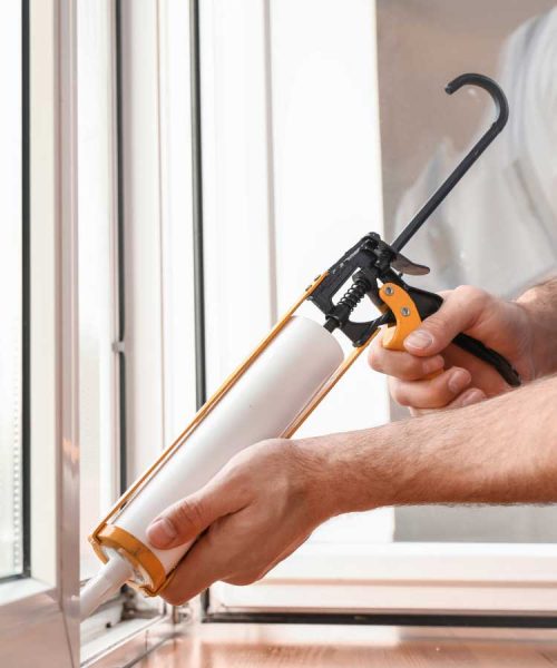 Applying-sealant-to-a-window-frame-for-proper-insulation